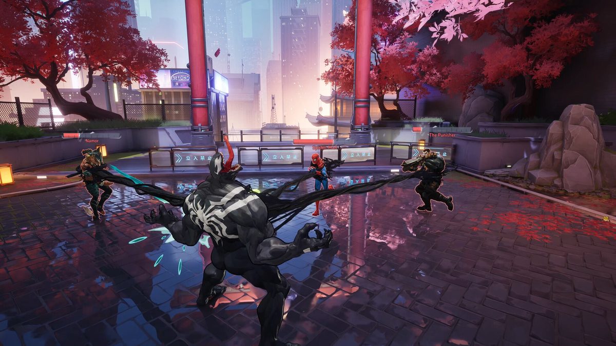 Capture officielle de Marvel Rivals : un affrontement dans une rue de Tokyo sous des arbres rouges, plusieurs héros engagés à des hauteurs différentes, avec des toits et des passages qui ouvrent autant d'angles